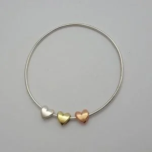 Sterling Silver Bangle With, Copper, Silver And Brass Sliding Hearts - Large(67mm)